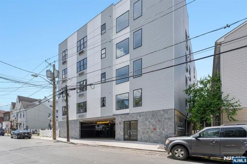 Photo of 6062 Plum Street, Paterson, NJ 07503 (MLS # 26025863)