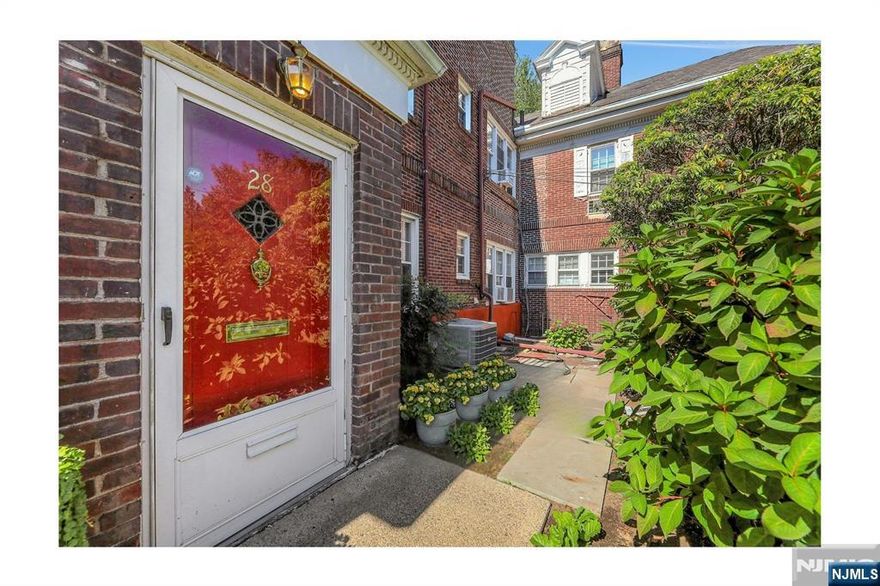 Hidden gem in the Country Club section of Teaneck! Rarely available, brick townhouse-style condo in prime central location. Move right in to this spacious, charming, and well-maintained home with high ceilings, updates (including central air!) and tons of storage. Large living room with office nook, dining room perfectly suited to entertaining, updated kitchen w/door to parking & yard, powder room and laundry on the ground floor. Second floor contains primary suite (with bathroom), 2 additional bedrooms, a hall bathroom and pull down attic. Private front patio, shared backyard space, off-street parking space included. Less than 2 blocks to NYC buses, the public library and the top rated bagels in New Jersey! PLEASE NOTE: * Entrance and mailing address is at 28 Monterey Dr. #4 (Commonwealth is the entrance to the original mansion that was divided into these 5 special units). * Common charges include heat, hot water, parking space, landscaping, snow plowing, gutter cleaning, garbage etc. Current charge includes $300/month assessment for work done to update heating system and property masonry; loan to be paid off 8/2026