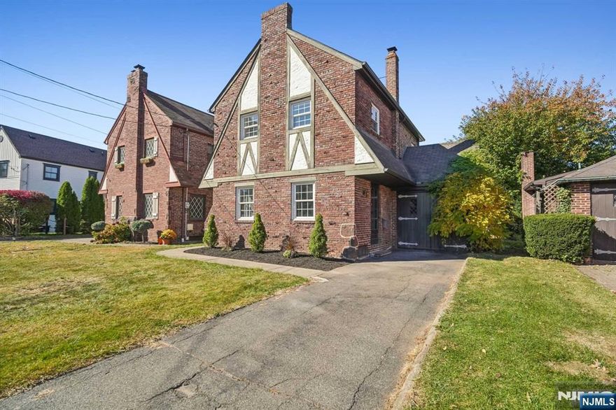 Stunning Tudor Colonial, where timeless elegance meets contemporary comfort. Impeccably maintained, this home showcases hardwood floors, central air, and updated windows throughout. Beautifully landscaped yard adds undeniable curb appeal, with a classic front entry welcoming you into a warm, character-filled interior. On the main level, a bright formal living room with wood-beamed ceilings creates a cozy yet refined atmosphere. Adjacent, the formal dining room provides an ideal setting for gatherings. The E-I-K is beautifully equipped with quartz countertops, stainless steel appliances, and a Dutch door leading to an enclosed 3 season room, seamlessly blending indoor & outdoor living. Upstairs, 3 spacious bedrooms await, featuring cedar-lined closets, along with a full bath. The lower level offers a convenient laundry/utility room and ample storage. Situated on a peaceful dead-end street.