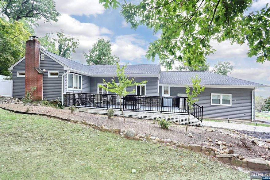 The moment you enter, you are greeted by a spacious open floor plan highlighted by a stunning kitchen & dining area perfect for entertaining. Newly finished oak floors flow seamlessly throughout the home, adding warmth & sophistication. The kitchen features shaker cabinets, sleek Corian countertops, chic herringbone backsplash, SS appliances & generous peninsula. The LR is the perfect spot to relax by the inviting wood-burning fireplace. The primary BR offers 2 closets & ample space for a king-sized bed. The 2nd BR is equally spacious. The bathroom is a stylish retreat with double vanity & tile shower over tub. The newly finished basement & loft provide endless possibilities, whether you envision a playroom, home office, or storage. Outside, a large deck & fully fenced yard await your adventures. If you're dreaming of more space, a new 4BR septic has been installed, paving the way for future expansion.