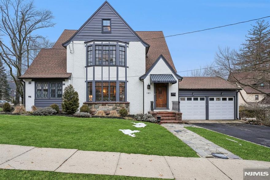 This beautifully updated five-bedroom, three-bath home blends timeless architectural charm with modern updates. A welcoming foyer sets the tone for the home's character and generous proportions. Rich natural hardwood floors, several original leaded-glass windows restored to perfection, and a striking wood-burning fireplace framed in slate and stone create a warm, comfortable atmosphere. The spacious living room is filled with natural light, while French doors open to a stylish Family Room. Designed for both everyday living and entertaining, this home features a formal dining room and a thoughtfully renovated kitchen appointed with quartz countertops, custom cabinetry, stainless steel appliances, and a separate breakfast nook. The newly updated primary bath features fresh, contemporary finishes. Plus a new central air system and new windows throughout the home, ensure modern comfort. The property includes a two-car garage. An exceptional residence for those who appreciate timeless design and the comforts of contemporary lifestyle. Welcome home!