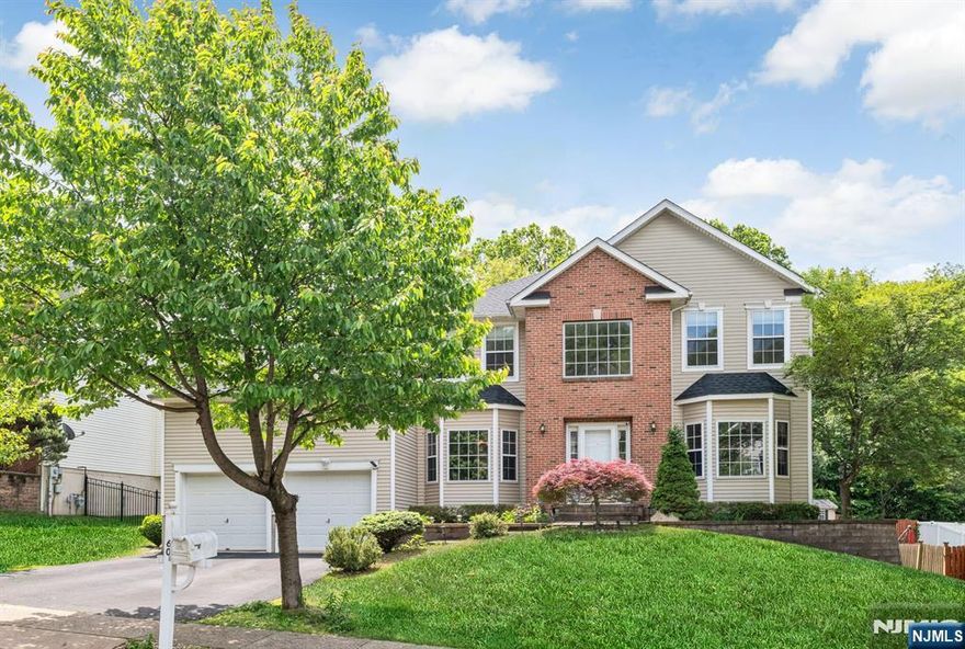 WELCOME HOME to this beautiful colonial with its prime location and modernized yet traditional floorplan. NEW ROOF installed in 2022 and FINISHED BASEMENT WITH FULL BATH, which adds an additional 1100 square feet of finished living space to this home, are some of the fabulous newer upgrades featured here. Step inside to a dramatic two story foyer with turned staircase surrounded by the formal living and dining rooms with bright bay windows. TWO STORY FAMILY ROOM with stacked atrium windows and cozy fireplace leads to the FIRST FLOOR OFFICE/STUDY, perfect for working from home. The kitchen is sunny and bright with stainless appliances, gas cooking, and breakfast room with sliders to deck and backyard. GARAGE ENTRY & LAUNDRY/MUD ROOM are on first floor level for great convenience in your daily lifestyle! PRIMARY BEDROOM SUITE shows off a tray ceiling, dual walk in closets, and PRIMARY ENSUITE BATH with soaking tub and stall shower. Finished basement offers many flex spaces for everyone including a CUSTOM BUILT WET BAR, GYM AREA, MEDIA ROOM, HUGE FINISHED STORAGE ROOM & FULL BATH WITH SHOWER. You will be impressed by the open and leveled backyard with storage shed, large enough for a future pool, and backs up to richly green wooded privacy. PUBLIC UTILITIES ARE HERE so you never have to worry about septics, wells or oil tanks! This fabulous home is located in one of Morris County's hottest neighborhoods and close to lake activities, schools, shopping and an easy NYC commute!