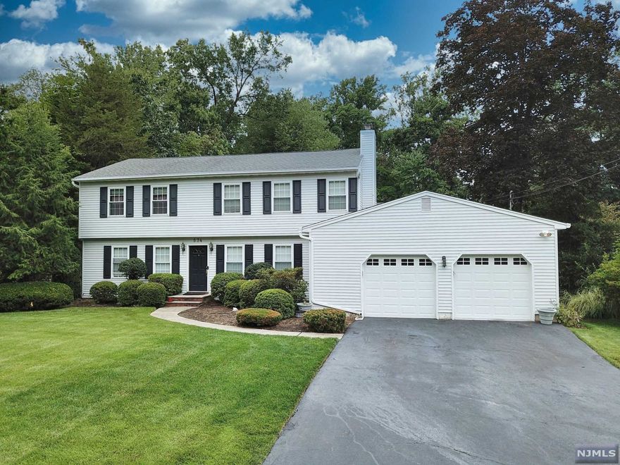 This is the Center Hall Colonial to come home to. This well maintained 3015 square ft home features 6 bedroom, 3.5 bath and 2 car garage is well designed and appointed with every detail you'd expect. High ceilings, crown moldings, hardwood floors thru out, family room with fireplace. Extremely large kitchen with breakfast area. Again, everything you would expect. Full finished lower level and parklike yard with a heated inground pool is ready for entertaining. Minutes away from train station, country clubs, Lake Tappen, shops and restaurants.