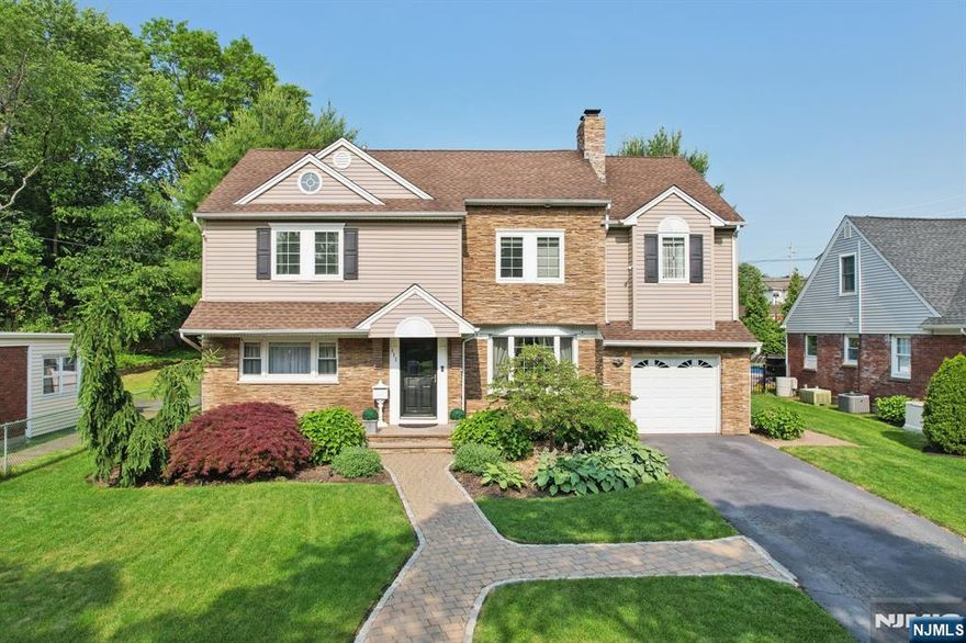 Welcome home to this Roughgarden 5-bedroom, 3 full bath Colonial nestled on a meticulous oversized property. Step into a find a large living room with dentil molding and cozy wood-burning fireplace, perfect for relaxing evenings. The updated eat in kitchen boasts gleaming cabinets, granite counter tops, stainless appliances and dining area, while mudroom/pantry provides convenient storage plus access to the garage. In addition, first floor offers 2 large bedrooms and updated full bath. The second floor showcases an extra-large primary suite with tray ceiling, two California closet fitted walk-in closets, and direct access to main bathroom with double sink, oversized spa shower, plus two additional bedrooms. The fully finished basement is built for fun, offering family room with custom wet bar, office, full bath, and abundant storage space. Host unforgettable gatherings in this resort like backyard complete with paver patio, pergola area, firepit area and sparkling pool. Additional highlights inc Generac generator. sprinkler system, central vacuum, central air, epoxy garage floor, fully floored attic for extra storage, California-fitted closets and pantry throughout. Top rated schools, two NYC train lines all in this desirable charming town!