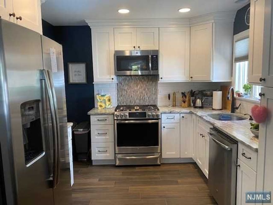 Immaculate and move-in ready. Open and airy living space. Beautiful newly remodeled kitchen with stainless steel appliances and granite counters. Separate dining area. Updated main bath. New AC, some new windows and a brand new driveway. Gorgeous hardwood floors. Full finished basement. Rec room with new flooring, half bath, laundry, storage area and built-in storage cabinets. The deck overlooks the yard and the wooded land behind the property. Patio under the deck. Storage shed. A great location. Joining the Skyline Lake Association is optional, activities include swimming, fishing, play area and community events and more. Visit skylinelakes.com for more information.