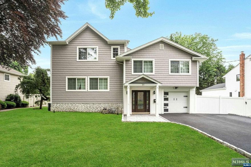 Welcome home! This newly renovated modern masterpiece nestled in the heart of one of the most coveted towns in Bergen County boasts 5 bedrooms, 5 bathrooms. Step inside to discover an inviting open-concept living space, where natural light floods through expansive windows, illuminating the sleek design and contemporary finishes.The gourmet kitchen is outfitted with stainless steel appliances, custom cabinetry, and quartz countertops. A large center island provides ample prep space and seating, perfect for entertaining guests or enjoying casual meals with family. Upstairs, discover 5 well-appointed bedrooms, 3 are full ensuite bedrooms ideal for children or additional guests. Outside, the expansive backyard oasis beckons for relaxation and entertainment, featuring a covered patio, pool and plenty of room for outdoor dining and recreation. Conveniently located this home offers easy access to top-rated schools,transportation, shopping, dining, and parks and recreational amenities.