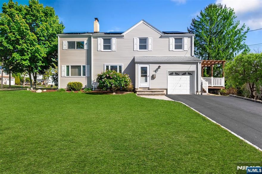 Welcome to this well-maintained and spacious Colonial nestled in one of River Edgeâ€™s most sought-after neighborhoods. This inviting 4-bedroom, 2.5-bath home offers an ideal layout for comfortable living and entertaining. New updates include HVAC, refinished hardwood floors, recessed lighting, vanities, freshly painted interior, and more! The main level features a bright living room with wood burning fireplace, a separate formal dining room, EIK, half bath and a generous family room that provides added flexibility for todayâ€™s lifestyle needs. Upstairs, the oversized primary suite impresses with an ensuite bath and ample closet space. Three additional bedrooms, a den and a full bath complete the second floor. The finished basement adds valuable bonus space for recreation, storage, workouts, or hobbies. Set on a desirable corner lot, the property includes a one-car garage, an asphalt driveway with Belgium block trim, and a large deck with pergolaâ€”perfect for outdoor dining and relaxation. Hardwood floors run throughout the home, enhancing its classic charm. With its prime location near top schools, parks, shopping, and transit, this is an exceptional opportunity to own a timeless River Edge Colonial and make it your own.