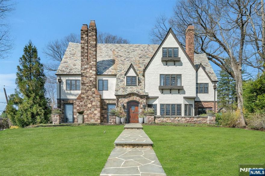 Sophisticated Luxury-Perched high on Crest Rd in Ridgewoodâ€™s sought-after Heights section, this stunning Tudor boasts breathtaking NYC skyline views and incredible sunrises. Extensively renovated in 2013-2014, this masterpiece is a collaboration btw architect Roger Schlicht of RDS Architects, Ulrich, Inc., & Karen Weidner Design, blending classic elegance w/ modern luxury.Boasting 7 BRs, 4 FBs & 2 HBs, 6 gas FPLs, office, HW floors, & exquisite architectural details throughout. The Ulrich custom kitchen features top-tier appliances & Calacatta gold marble opening to a vaulted family rm w/ grand FPL.The lower lvl is an entertainerâ€™s dream w/ a custom bar, media rm & pub rm, wine cellar & more! Professionally Landscaped private grounds spanning over an acre. Bluestone patios create an idyllic setting to enjoy Ridgewoodâ€™s 4th of July fireworks w/spectacular views.3car attach garage/ generator.Blocks from town, schools, & NYC trains, this turn-key estate offers a rare & refined lifestyle.