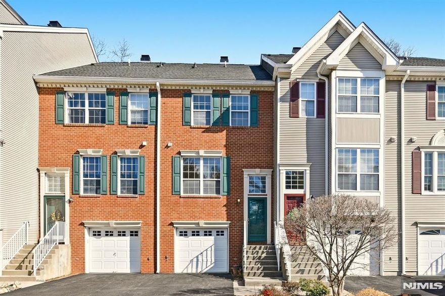 Opportunity awaits in Franklin Crossing, Mahwah. This well-maintained 2-bedroom, 2.5-bath townhouse offers approximately 1,564 square feet of living space, an attached one-car garage, and a finished basement for added flexibility. The main level offers open-concept living with a spacious kitchen, dining area, and living room that leads to a patio for easy outdoor access. Upstairs, the primary bedroom includes a vaulted ceiling, double closets, and a full bath. A second bright bedroom, full hall bath, and convenient laundry complete the upper level. The finished basement provides valuable additional living space, ideal for a recreation room, home office, or gym. Set in a quiet location on Chedworth Circle and backing to a wooded area, the home offers privacy and peaceful views. Ample guest parking is available. Residents of Franklin Crossing enjoy amenities including a pool, tennis courts, playground, and landscaped grounds. Conveniently located near shopping, restaurants, parks, major highways, and NYC transportation. A great chance to own in Franklin Crossing and make it your own.