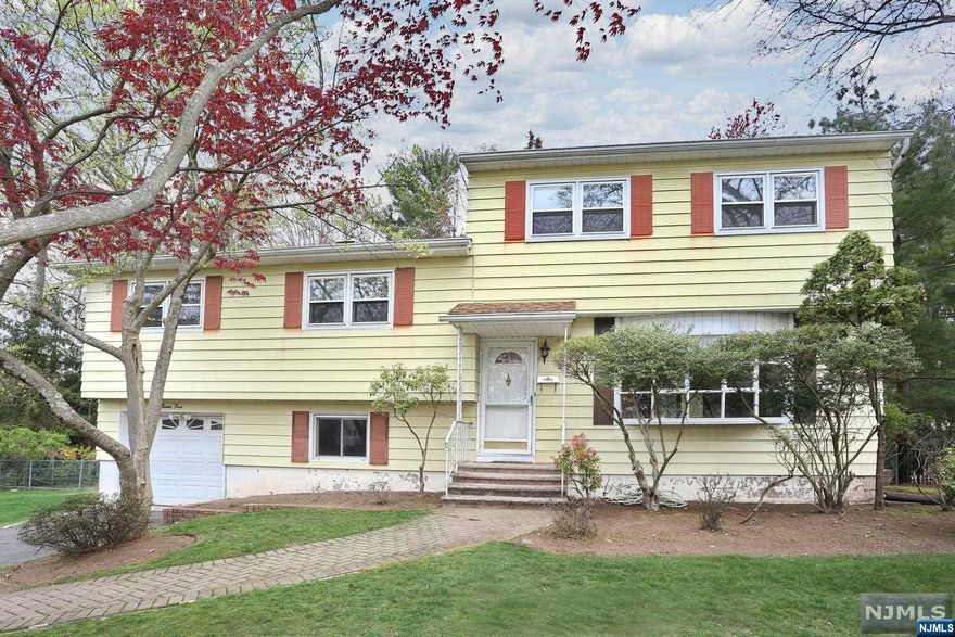 Diamond in the rough! Large expanded Split level on a generous size lot, in a beautiful neighborhood. This home needs complete renovation and will be sold as/is, however the value is here! Walk into the entry foyer to a large living room and dining area with sliding glass doors to a deck. . Picture yourself sitting at a banquet in the kitchen overlooking the large property. .The second level contains a master bedroom w/bath, 2 bedrooms, & a full bath with double sinks and tub/shower. . A third level was added as a bonus area containing 3 extra bedrooms, plus an office/den for those of you working from home! A large Family Room & Laundry room w/1/2 bath is on the lower level. One flight down is an unfinished basement area. Come & see the potential for yourself!!!!