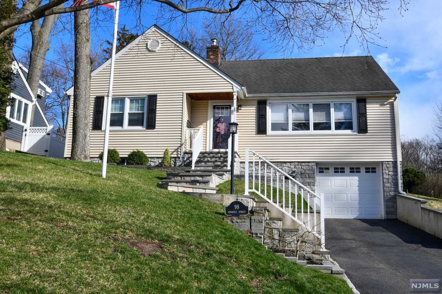 Stunning 4 b/r 1.5 bath C/C with an attached garage is beautifully situated on meticulously landscaped property in the heart of Caldwell. A bright entryway welcomes you to this open concept home with gleaming h/w floors, crown molding, and exquisite designer details throughout. Unwind in the sun soaked L/R. Easily prepare meals in the eat-in-kitchen complete with sleek granite countertops, s/s appliances, and a gas range. The adjacent D/R leads to an incredible Sunroom surrounded with windows. Two B/R on the main floor are opposite a recently renovated full bath with radiant heat floors, a chic double vanity, and cool marble. Upstairs two additional B/R each have ample closet space. The fully finished lower level is the center of entertainment. A built-in kitchen/bar features quartz countertops, a wet bar, a full refrigerator, a convection oven, a dishwasher, and a wine refrigerator. The rec room, mudroom, laundry area, and utility space are as stylish as they are functional.