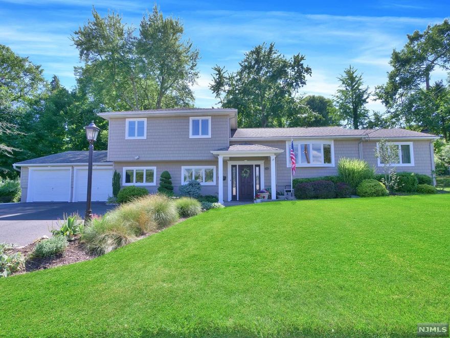 Beautifully updated Split-Level in great section of Wayne featuring 5 bedrooms and 3.5 bathrooms! Greet your guests in then entry foyer which leads upstairs to the main level. The dining room is just off of the entry & will be the perfect place to host holiday dinners! Cased opening leads into the kitchen and great room, which is truly the heart of the home! The gorgeous kitchen offers custom cabinetry, stainless steel appliances, granite countertops, center island w/ bar stool seating & separate dining area. The kitchen flows right into the family room with vaulted ceilings, brick faced fireplace & skylights. The large windows & skylights allow great natural light to fill the room. Sliding glass doors lead to deck. The primary suite offers sizable bedroom w/ large walk in closet & full bathroom w/ skylight, jetted tub, stall shower w/ glass enclosure & storage vanity. The 2nd floor offers 3 bedrooms & full bathroom featuring tub shower with sliding glass enclosure and vanity.