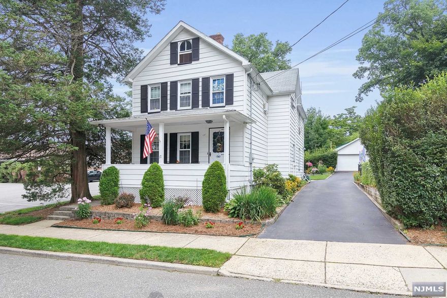 1700 sq. ft. Antique Colonial home located in beautiful Midland Park (on the Ridgewood border). This home offers the character of yesteryear with an open front porch, hardwood floors and a true feeling of home. The 1st fl offers a living room, dining room, large eat-in-kitchen(with Maple cabinetry) and a powder room/laundry. The 2nd floor has 3 bedrooms and the main bath. Don't miss all the storage available in the floored attic as well as the unfinished basement. Outside is an inviting inground swimming pool, lots of pretty perennials as well as a patio and a 2-car garage. Located within walking distance of shopping and NYC bus and convenient to the Ridgewood train station and the center of Ridgewood.