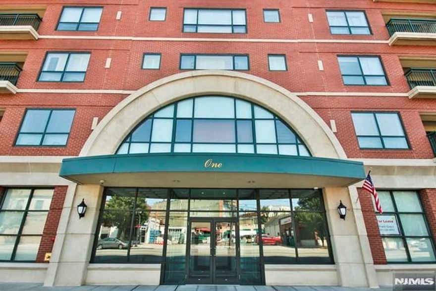 Over 1,300 square feet of gracious living awaits in this beautiful 2-bedroom, 2-bath condo with parking, located in a luxury building in the heart of downtown Rutherford. Conveniently situated directly across from both the bus and train, offering an easy commute to NYC. This spacious unit features an inviting entry foyer with hardwood floors, leading to a modern eat-in kitchen with granite countertops, tiled backsplash, and a dining area. The custom open living room includes crown molding, recessed lighting, and hardwood floors, with access to a large private terrace. The primary en-suite bedroom offers a walk-in closet and a luxurious bath with double sinks, a jetted tub, and a separate shower. The spacious second bedroom also features a walk-in closet. Additional highlights include in-unit laundry, central air conditioning, an assigned covered parking space (additional parking available for a fee), and a private storage room located on the parking level. Ideally located close to shopping, dining, and transportation. A small, well-behaved dog may be considered. Landlord requires a rental application, credit check, and proof of ability to pay.