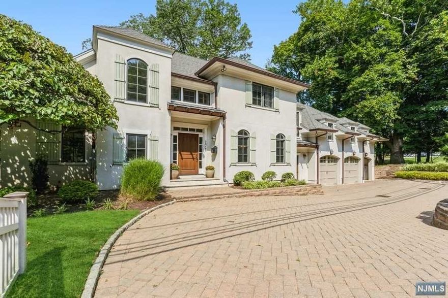 Just 10 miles from NYC, this spectacular five bedroom colonial sits high atop Demarest's sought after East Hill. Enter in the the grand two story foyer appointed with custom architectural moldings. Formal dining room and living room offers luxurious settings, perfect for entertaining! Breakfast nook with fireplace and large gourmet kitchen opens to gracious family room also with a fireplace. Second floor Master Suite with fireplace has two walk in closets and spa like bath. Three additional junior suites and laundry room complete second floor. Full finished basement is complete with rec area, arts & crafts room, gym, bedroom and full bath. Beautifully landscaped outdoor space with pool. Close proximity to Blue Ribbon schools and convenient transportation.