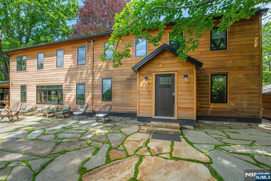 Fly in with your plane and park it in your private hangar! 2500' runway! 800' elevation. Listed on the aeronautical charts as a private airport named Mt Pleasant. Welcome to Whispering Pines Estate, a rare 208-acre sanctuary in Columbia, NJ. This lucrative Airbnb retreat features a rustic-modern main house, a detached chef's kitchen/dining lodge for 12, and a private guest house. There is also an office/spa retreat building and a barn. Luxury amenities include an in-ground heated pool, hot tub, sauna, yoga studio, and even a private airstrip with a hangar. Enjoy miles of pristine hiking trails, scenic vistas, andorganic gardens. Perfect as a private residence, wellness venue, or high-end investment. Experience ultimate secluded luxury.. This is one of a kind, don't miss it!