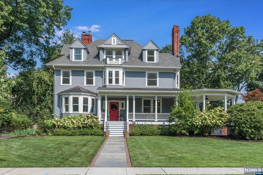 Set on a quiet, picture-perfect tree-lined street in the Estate section, this incredible property is within walking distance to the shops and restaurants in downtown Montclair. Built for entertaining, a spacious LR, Library & DR are adorned with elaborate woodwork, cozy spaces & beautiful architectural details. The heart of the home is a chef's kitchen, with professional appliances (Wolf and Bosch), Crown Point custom cabinetry, soapstone countertops, and a walnut island.The primary suite is a true sanctuary with a large dressing area, custom built-ins. Unwind in the spa-like bathroom featuring Ann Sax limestone, double walnut vanity and a Boffi soaking tub. Step outside into the meticulously landscaped gardens, where lush greenery and mature trees provide a serene backdrop for outdoor gatherings or a quiet afternoon retreat. Don't miss your chance to own a piece of architectural history in this exceptional property.