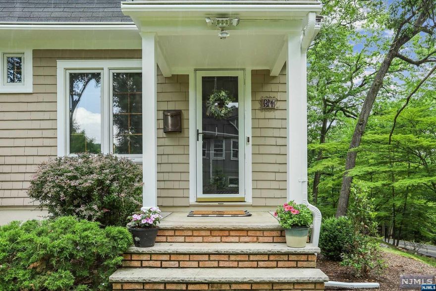 Charming 4 bedroom Colonial located in the highly sought after Oakridge neighborhood. Walk through the large foyer/mud room to the beautiful living room with coffered ceiling and wood burning fireplace that is the centerpiece of that room. Then to the dining room with charming built-in cabinets which leads to the renovated kitchen with radiant heat flooring, center island and large pantry. Three season porch overlooks a stone patio, picnic area and green flat side yard. Laundry room and powder room make up the first floor. 4 bedrooms on the 2nd floor, one being used as a WFH office, with two renovated full baths. Walk-up attic. Lower level has unfinished spacious basement with lots of rooms and storage . Around the corner from Forest Ave Elementary, NYC bus and only a few blocks from the magnificent 54 acre Verona Park, Verona Community Center, downtown shops and restaurants.