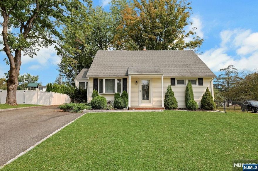 On a peaceful cul-de-sac, this thoughtfully expanded home offers charm, space, and numerous upgrades throughout. From the moment you step inside, you'll notice the character that sets this home apart. The kitchen features granite countertops, stainless steel appliances, and opens to a sun-drenched breakfast room with skylights - perfect for morning coffee. Step outside to a nearly 1/3-acre level yard, ideal for outdoor gatherings or relaxing evenings. Enjoy formal meals in the sizeable dining room or unwind in the spacious living room addition, complete with a cozy wood-burning stove. Hardwood floors run throughout the first and second levels, adding warmth and continuity. The main level offers two generously sized bedrooms and a full bath. Upstairs, you'll find two additional bedrooms, another full bath, and a versatile loft space - perfect for a home office, reading nook, or play area. The partially finished basement is an entertaining hub, featuring a bar and plenty of space to host. This level also includes a laundry area, utility room, and storage. All this - just a short walk to NYC transportation, shopping, schools, and parks. A rare opportunity in a great location!