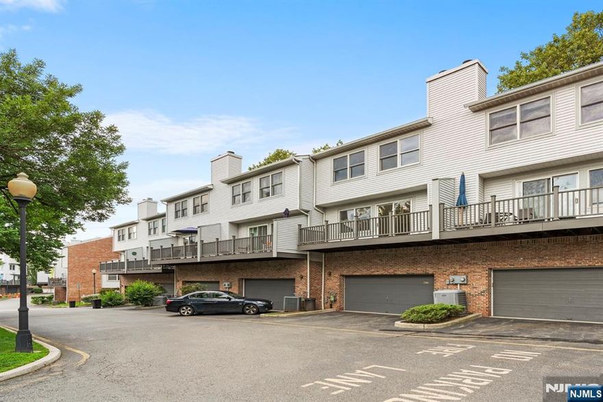 Welcome to PANORAMA TOWNHOMES, 473 Undercliff Ave, Edgewater! Rarely available 3-level townhouse featuring 3 bedrooms and a private 2-car garage, ideally situated in the heart of Edgewater. This east-facing home offers approx. 1,912 sq.ft. of stylish living space with street-level entry to a spacious main floor, lower level recreation room, and an upper level with three generous bedrooms. Highlights include hardwood floors, recessed lighting, a beautifully updated kitchen and bathrooms, and a wood-burning fireplace. Enjoy a private deck, 2-car garage, plus driveway parking. Prime location-just two blocks from Whole Foods, steps to NJ Transit, and a short 5-8 minute walk (0.3 mile) to the Edgewater Landing Ferry for a quick and easy NYC commute. Experience the best of Edgewater living!