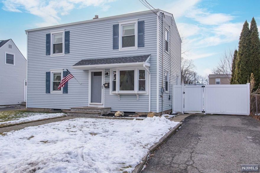 Welcome Home! Lovely & Updated, this colonial is ready for the next homeowner. Updated Kitchen is bright with mosaic tile backsplash and open to dining room with wood laminate flooring. Kitchen also has access to yard & patio plus Gas Hook-up for your Barbeque. Spacious living room with gorgeous wood laminate flooring, full bath and playroom leading to beautiful fenced rear yard complete the first level. Upstairs you will find 3 spacious bedrooms, all with lots of closet space and updated full bath. Full basement with laundry, utilities, workbench and lots of storage plus bilco-type door to yard. This is a house you will be proud to call "home".