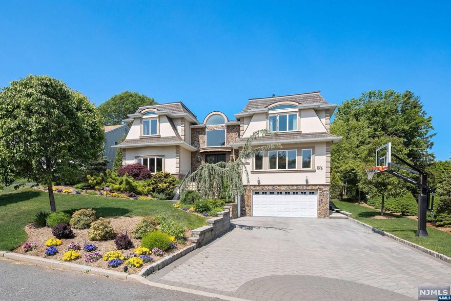 A unique window of opportunity to own a stunning 5,179 Sf home on an oversized 75x225 lot. Featuring 5 beds, 7 baths, finished basement, and 2 car garage. An entertainers dream backyard with a chef's outdoor kitchen and gunite oasis pool w/ full outdoor bath. Just updated 2 story great room/a primary suite with huge outdoor terrace/gourmet EIK/radiant floors/finished walk-out basement with gym/low taxes/cul-de-sac. ALL oversized rooms/Total livable sf is over 7,000 - Truly a rare lot and home for Paramus.