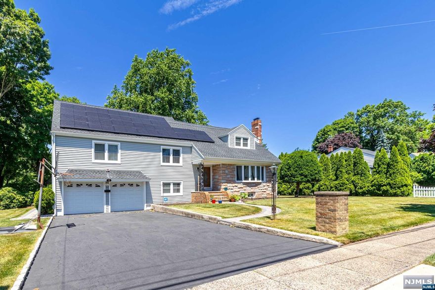 Welcome to this stunning Split-Level home in the sought-after Montclair Heights neighborhood of Clifton, NJ. Featuring 4 bedrooms and 3 bathrooms, this spacious residence sits on a DOUBLE lot! The property includes a 2-car garage and an additional 4-car driveway, ensuring ample parking. Energy efficiency is enhanced with solar panels, and the finished basement, complete with a bar, offers an ideal space for entertaining. Conveniently located, this home is just under an hour's commute to Midtown NYC, making it perfect for anyone seeking easy access to the city. You'll find yourself moments away from Montclair, NJ, Garden State Plaza Mall, Newark Airport, parks, and more, providing easy access to shopping, dining, and recreational activities. This home blends comfort, style, and convenience, creating an ideal living environment.