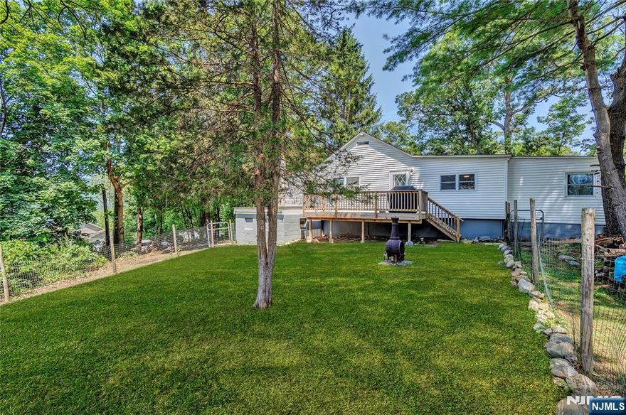 Charming Greenwood Lake Retreat Just One Hour from NYC! Welcome to your getaway in the Greenwood Lake Cooper section of Hewitt, New Jersey perfect as a weekend escape or a cozy year-round home. This inviting two-bedroom offers lake views from the spacious front deck, where you can relax with a morning coffee or evening glass of wine and take in the beauty of nature. Inside, you'll find a generous eat-in kitchen with plenty of space for gathering, a stylish brick fireplace in the living room that adds warmth and character, and two well-sized bedrooms. The home also includes a convenient laundry area everything you need for easy living! The partially fenced yard is ideal for pets, gardening, or simply enjoying the outdoors. Two sheds offer great storage for tools, toys, or gear. Love hiking? Trails begin just outside your front door. Appalachian Trail close by! Greenwood Lake is a hub for adventure, with marinas for boat rentals, Browns Point for launching your kayak or car-top boat, and plenty of forest to explore. Plus, you're just minutes from Warwick, NY home to charming shops, wineries, top-rated restaurants, and a classic drive-in movie theatre. Don't miss the chance to own a slice of lake-and-forest living, just an hour from the hustle and bustle of NYC! Septic system professionally monitored and maintained. Newer roof. New Deck. New water treatment system. Join nearby Greenwood Lake Beach Association for beach, dock and lake access.