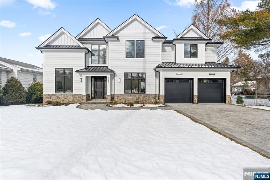 Welcome to 327 Harristown Road, Glen Rock, NJâ€”a distinguished new construction that epitomizes modern living. This expansive residence offers six bedrooms and five and a half bathrooms, designed to accommodate both comfort and luxury. Step inside to discover a two-story family room that serves as the heart of the home, providing an inviting space for relaxation and connection. The chef's kitchen is a culinary dream, equipped with premium Sub-Zero and Wolf appliances, ensuring every meal is prepared with precision and style. The primary suite promises a spa-like bathroom, designed to offer a tranquil retreat with high-end fixtures and finishes. Each additional bedroom is thoughtfully planned to maximize space and privacy, catering to various lifestyle needs. For entertainment enthusiasts, the property boasts a state-of-the-art movie theater and a basement bar, perfect for hosting movie nights or casual get-togethers. Fitness lovers will appreciate the dedicated gym space, allowing for workouts in the comfort of your own home. Located in the sought-after community of Glen Rock, this property offers proximity to excellent schools, parks, and local amenities, enhancing its appeal for families and individuals alike. Explore the possibilities of owning a home that combines sophisticated design with practical living spaces. Contact us today for more information and to schedule a viewing. Your future in Glen Rock awaits!