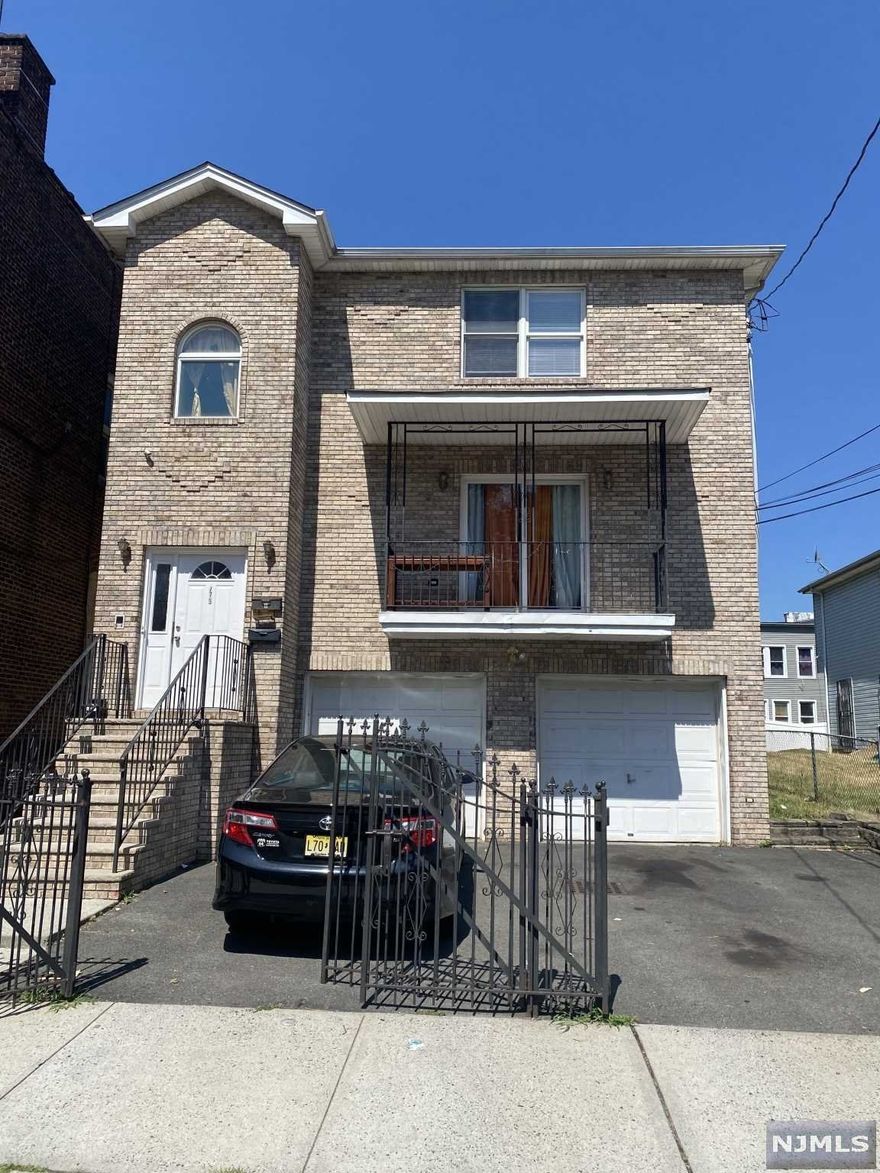 Newer construction legal 3 family All separate utilities Central Air Hardwood floors through out . Should qualify for all types of financing