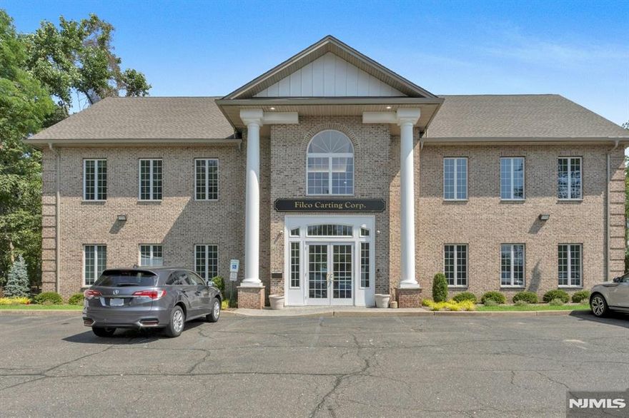 Immaculate Brick Office Building with Expansive Layout in the Heart of Closter - A Must See! Welcome to this stunning two-story commercial building, offering an impressive floor plan and exceptional natural light throughout. The spacious and inviting foyer features soaring ceilings and dramatic floor-to-ceiling windows, creating a bright and welcoming atmosphere. The first level includes a comfortable waiting area, three corner offices, seven additional private offices, and a few cubicle workstations - perfect for a productive team environment. A generously-sized conference room provides ample space for meetings and presentations. A convenient summer kitchen with wood cabinetry is ideal for preparing coffee or lunch breaks. Tsitting area. You'll also find two expansive corner office suites with elegant wood-paneled detailing, ideal for high-level meetings or private client consultations. Another corner office, multiple cubicles, and two additional bathrooms complete the second level. Outside, the NEW landscaping on the property offers excellent curb appeal, along with a large private parking lot for staff and visitors. Located in the heart of Closter, this prime property is ideal for professional offices, a corporate headquarters, or a boutique firm seeking a refined and spacious setting. BRAND NEW ROOF. SPRINKLER SYSTEM, FLAG POLE & FENCE around garbage!