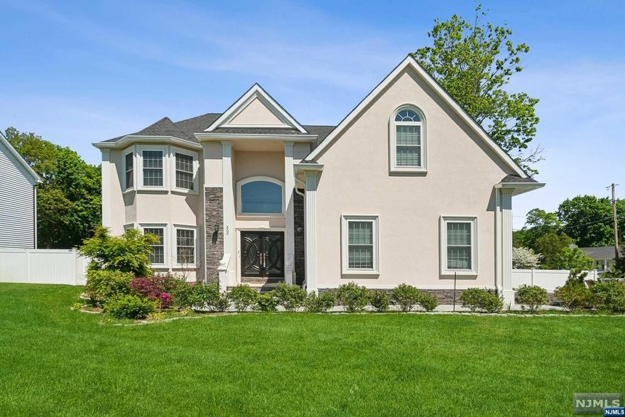 Welcome to your 4 BR, 3 bath residence! This custom center hall colonial exudes sophistication & charm. Step through the double door entry into a foyer adorned with a half-crescent window framing a crystal chandelier suspended in the center, complemented by a bespoke wood & wrought-iron staircase leading upper level. Beyond the foyer lies a Fam Rm with a cozy gas fireplace with marble surround. Kitchen boasts granite countertops, stainless appliances, marble breakfast bar accommodating seating for 6. Completing the 1st flr is a BR & FB. Upstairs, discover another FB along with laundry room, 3 BRs, including Primary Suite showcasing vaulted ceiling, dual closets, en suite bath complete with glass-enclosed shower, marble accents, rejuvenating soaking tub, double vanity, separate water closet. Finished basement adds another 1,250 sq ft of living space. Enjoy large yard with professional landscaping & stone patio