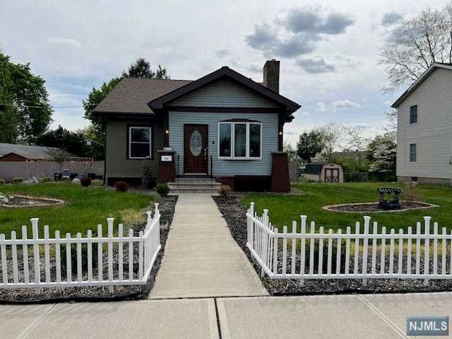 Wonderful opportunity to own in Pompton Lakes. A 2,019 square foot property. Enter a three season enclosed porch and into a large, newly updated living room and dining room with hardwood floors, stone fireplace, recessed lighting, and new windows. Perfect for entertaining. Kitchen offers great storage with loads of cabinets and a breakfast nook. Back entrance to a large fenced in yard with concrete patio. Two bedrooms and bath on the main floor and two bedrooms upstairs. Large unfinished basement perfect for storage or for updating. Two extra stoves and a refrigerator in the basement included. New roof, new furnace, new hot-water heater. Large, newly paved driveway that can fit multiple cars. Walk to the lake down the block and fish off the dock, play in the playground, or just sit in the gazebo and watch the ducks. You can even launch a boat. Schools and shopping nearby and easy access to Routes 23 and 287. Move in ready. Begin to make memories.