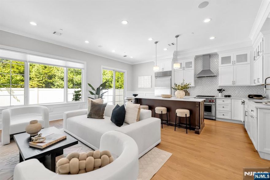 Stunning luxury townhome at Gabriel Estates, a boutique community in the heart of Paramus. Built just a few years ago, this spectacular residence has been fully upgraded with elegant trim and moldings, designer wall coverings, custom cabinetry, and a built-in home office within the primary suite. The home offers 3 bedrooms, 2 full bathrooms, and 2 half bathrooms, featuring soaring 10-ft ceilings on the first floor and 9-ft ceilings upstairs that create an open, airy ambiance. The gourmet chefâ€™s kitchen boasts Sub-Zero/Wolf appliances, quartz countertops, and sliding glass doors leading to a private, fenced-in backyard. The impressive primary suite includes a massive walk-in closet and a spa-like bath with a Jacuzzi tub, oversized shower, and double vanity. The fully finished lower level expands the living space with an incredible recreation room and a custom wet bar with beverage center, perfect for entertaining. Enjoy serene outdoor living with a private patio and yard, all while being minutes from the Garden State Parkway, Route 17, world-class shopping (Trader Joeâ€™s, Whole Foods, Garden State Plaza, Shake Shack, Container Store, Crate & Barrel, and more), plus access to Paramusâ€™ top-rated schools.