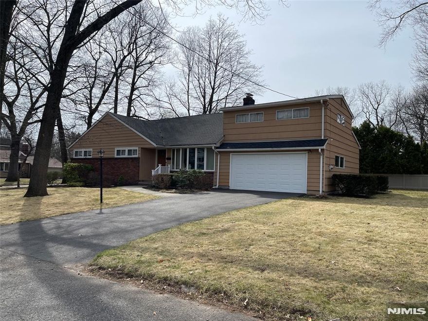 Beautifully maintained 5-bedroom home on a quiet street near a park. The bright living room features a fireplace and plenty of natural light. The primary bedroom includes a full bath and generous closet space. Home office/den off the living area. The second level offers two additional bedrooms and a full bathroom, providing flexible living space for family, guests. The upgraded kitchen and well-kept interior make this home truly move-in ready, with potential to expand if desired. Situated on a large property, the home features a deck spanning the entire back of the houseâ€”perfect for relaxing or entertaining. Additional highlights include a full basement, a large two-car garage, sprinkler system, spacious driveway, and a full-house generator for added peace of mind.