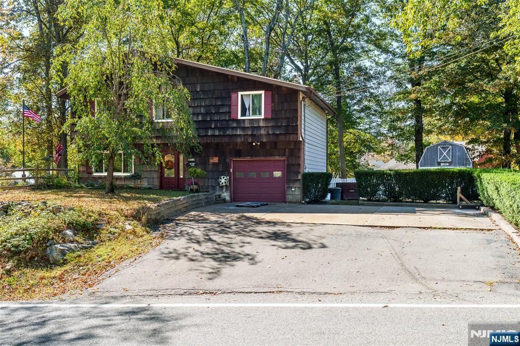 Photo of 25 Longhouse Drive, West Milford, NJ 07421 (MLS # 25035686)