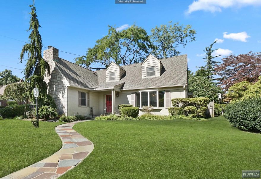 Welcome to this sunny cape set on a quiet tree-lined st in sought-after Fair Lawn. The timeless ext & cheerful red door invite you into a welcoming foyer. To the left, a generous LR w/ white stone fplc & to the right, a large DR bay wndw & built-ins for storing serveware or displaying a cherished collection. Flowing easily into the massive eat-in kitchen this space truly is the heart of the home. Anchored by a large cntr island bathed in natural light from the skylights over the adjoining seating area. This kosher-style kitchen equipped w/ high-end appliances including separate sinks, w/ 2 ovens & dishwashers-- tons of counter/cabinet space & doors to the stone patio! This home boasts 4 well-appointed BR incl. 1st flr en-suite w/ spa-like bath. The full finished basement w/ a rec room and separate space for a gym or playroom! Don't miss the large summer kitchen w/ tons of extra storage space. A detached 2-car garage, large driveway and semi-fenced yard. Don't miss this one!