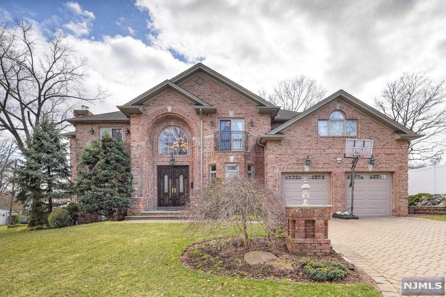 Welcome to this Majestic Custom Built Colonial Style home featuring all Brick Facade, Paved driveway, and Leveled Backyard and Located In the Heart of Demarest! Soaring Double Story Foyer invites you in to the Open Flow of the First Floor that features Gleaming Hardwood Flooring throughout the Living Levels! Gourmet Italian inspired Kitchen Features Newer Viking Stainless Steel Appliances, and Coveted Butler's Pantry! On the second floor, the Master bedroom Suite offers an office, Tray Ceiling with Custom Window Treatments! Ensuite Master Bath features Radiant Heated Floors, and Jacuzzi for Ultimate Relaxation! A "Princess Suite" and Generously Sized Bedrooms Complete the Top Floor. Basement features Office and a Fifth bedroom with a Full Updated Bathroom. With Whole House Generator Public utilities, Commuter Friendly Location, and Prestigious Demarest School system, this home is not to be Missed!!