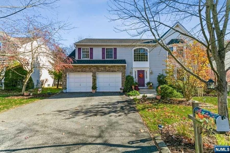 This stately colonial model home sits on a lovely lot in desirable Hillsdale. Great schools and downtown shopping add to the appeal of this beauty. There are 4 generous sized bedrooms including a master suite with full bath, cathedral ceilings, whirlpool soaking tub and 2 walk-in closets. All of the other bedrooms have double closets and oversized windows. The 2-story entry foyer greets guests with a palladium window and a plethora of natural light. Downstairs is the formal living room, dining room, kitchen, powder room and family room. The open floor plan offers an eat-in kitchen with center island overlooking the family room with gas fireplace. Sliding doors lead out to the large deck and bucolic backyard. There is also a finished basement with a recreation room and full bathroom. There are beautiful oak hardwood floors throughout the home as well which add to the elegance. This home is very well maintained and is move-in ready. Come and take a look, you will not be disappointed