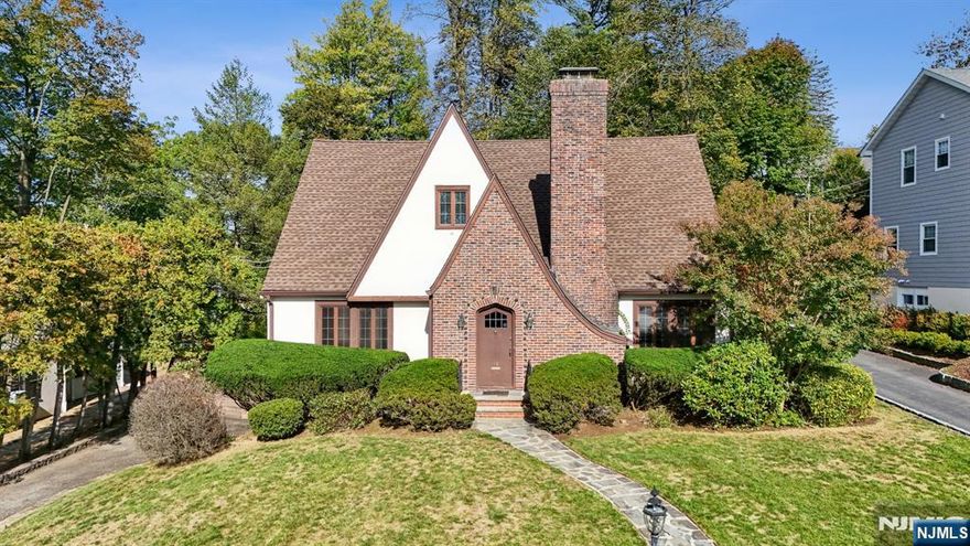 Welcome to this beautifully maintained 3-bedroom, 1.5-bath Tudor-style home, ideally situated near Verona Park in one of the town's most desirable neighborhoods. Step inside and be greeted by an inviting, spacious layout that blends classic character with modern comfort. The first floor features a bright living room with a fireplace, a formal dining room, a cozy family room with its own fireplace, and a well-appointed eat-in kitchen. A convenient powder room completes the main level. Upstairs, you'll find a large main bedroom, two additional bedrooms, and a full bath. The finished basement provides flexible space for recreation or a home office, while central air conditioning ensures year-round comfort. Enjoy relaxing outdoors on the rear screened-in porch, overlooking a tranquil, generously sized backyard. A two-car garage adds convenience and ample storage. With its prime location near the park, timeless Tudor design, and thoughtful updates, this home is a true Verona gem.