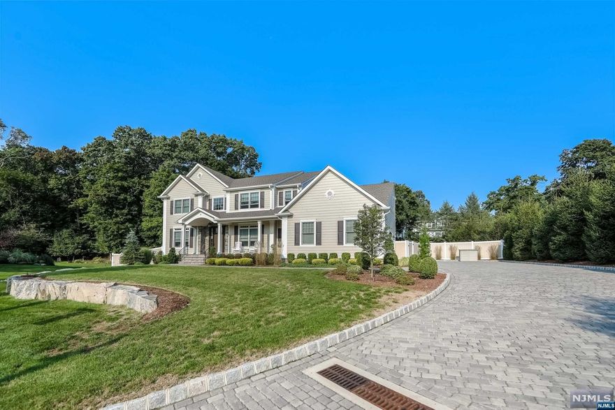 Center Hall Colonial newly built, approx. 2.5 years. Located at the end of a beautiful and mature cul-de-sac sitting high on the knoll overlooking development. Features approximately 3948 sq feet lower level, gourmet kitchen, luxurious primary bathroom with shower soaking tub and double vanity, spacious closets all with custom shelving, hardwood flooring, 9 foot high ceilings, open floor concept, fenced in yard, central vac security, covered blue stone patio with fan, 3 car garage. Custom Belgium block pavers with Belgium block edging. Top rated town named One of the Best Place to Live in 2022, easy access to Wegman's, Whole Foods, Shop Rite, etc. Priced to sell.