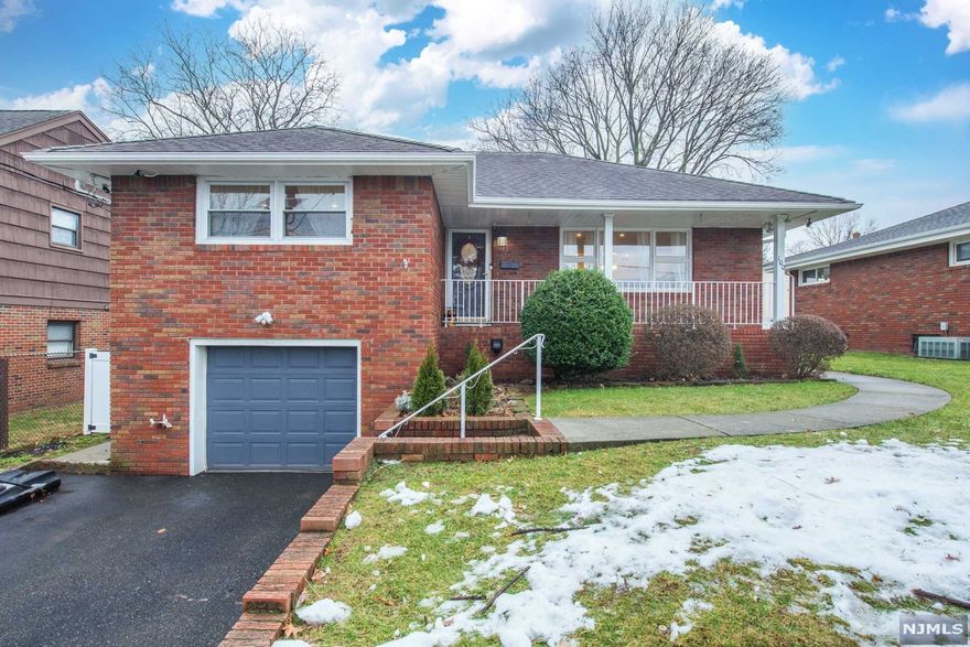 Immaculate Renov Ranch Offers Comfortable Living on One Level. Perfectly Situated in Residential Neighborhood Minutes Away from NYC Bus and Train. This Beautiful Home Offers 2 Large Bdrms, 2 Full BA, Totally Fin Bsmnt for Addit Living Space and Bonus Rm on the Attic.Main Floor Welcomes You to Sunny Liv Rm that Leads to Formal Din Rm and Kit.Enjoy a Movie in your own Liv Rm with Home Theater Surround Sound System. Updated Kit Offers Quality Cabinets, Granite Ctrs, Newer Appl and Tile Flr.Relax on Large Deck Overlooking Private Yard.Plenty of Closets and Storage.Bsmnt Has Generous Size Rec/Fam Rm with Private Full Bath, Seperate Laundry Area and Walkout - Perfect Extended Family Set Up.Fin Attic Currently used as Office. Gleaming Hrdw Floors,Heated Floor in Main BA, Recessed Lighting,Crown Moldings,Newer A/C, hot water/waterboiler. Freshly painted interior, exterior and much more. Wide Driveway Leads to Spacious Garg. Close to NYC trans, schools, shops, COMMUTERS DELIGHT!