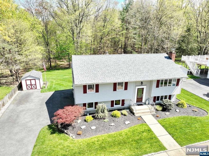 Welcome to your serene sanctuary nestled in a tranquil, show-stopping location! This home boasts a prime location backing up to beautiful wooded land with breathtaking natural scenery. Immerse yourself in the beauty of nature from the comfort of your own deck, where you can savor bucolic views. Step inside to a meticulous home. The heart of the home, the beautiful white shaker style kitchen, is sure to please with its gleaming granite counters and stainless steel appliances. A breakfast bar provides the perfect spot for casual dining or entertaining, while the open layout seamlessly connects the kitchen to the dining room, creating an inviting space for gatherings and creating lasting memories. Every inch of this home exudes pride of ownership, with updated bathrooms adding to the appeal. You can simply unpack and start enjoying the comforts of home sweet home. Don't miss your chance to own this gem! Twilight open house Thurs. May 9, 6:00-7:30