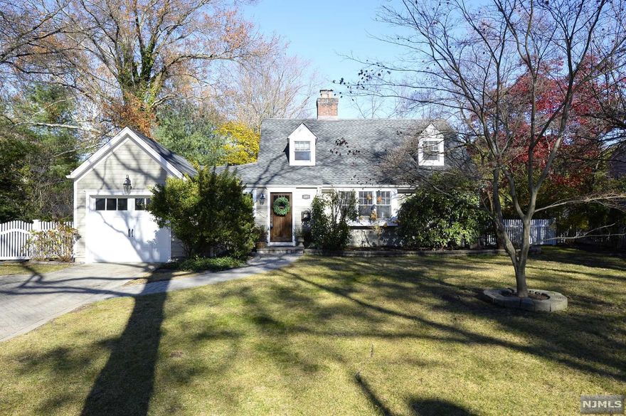 The homeowner requests no more showings!! the house you've been waiting for on one of the most desirable tree-lined streets in town. This charming expanded cape cod is deceivingly spacious with 5 bedrooms and 3 full baths. With a bright southern exposure the entrance foyer leads to an open floor plan. The openness gives way to a large living room with hardwood floors and a stunning wood-burning fireplace. A bonus play area leads to the gorgeous granite kitchen and a dining room leading out to the new paver patio. The first floor also has 2 bedrooms and a full bath. The 2nd floor has 2 more bedrooms, another full bath and the primary en suite with a steam shower. Fully finished large basement great for a playroom or entertainment area along with laundry room and plenty of storage. The backyard has a large paver patio and is private for enjoyment year round. It is fully fenced-in including a children's swing set. Great for summer BBQ'S!