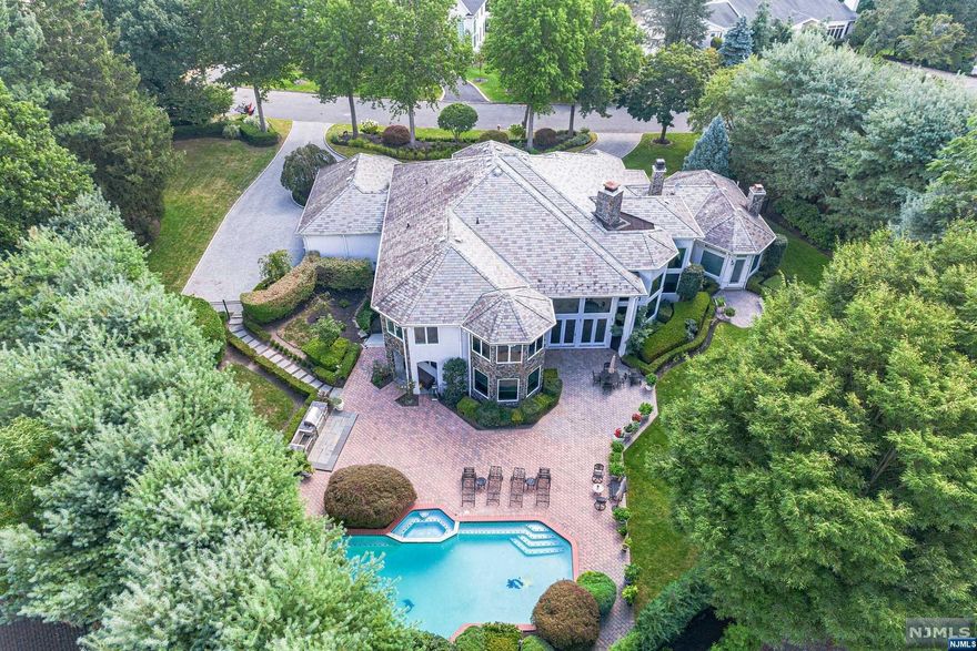 PRESTIGIOUS TAMMY BROOK ESTATES WITH MAGNIFICENT CUSTOM BUILT HOME, DECORATED BY WORLD-RENOWNED DESIGNER DAVID BARRETT. BEAUTIFUL LANDSCAPING DESIGNED LANDSCAPING. PAVED PATIO, HEATED POOL W/SPA. INSIDE IS A GRAND 2-STORY MARBLE ENTRY FOYER,EXQUISITE OPEN FLOOR PLAN FEATURING SOARING CEILINGS AND WALLS OF GLASS. ELEGANT GREAT ROOM W/BRAND NEW CHERRY WOOD FLOOR. FLOOR TO CEILING FPL.OVERLOOKING THE PRIVATE GARDENS, ADJOINING FAMILY ROOM W/MEDIA CENTER & WET BAR, LUXURIOUS DINING ROOM WITH HAND-PAINTED CEILING AND GLAZED WALLS ADORNED WITH SCONCES; PANELED LIBRARY W/22'CEILING&CHERRY WOOD CABINETRY. SUNNY MODERN CHEF'S KITCHEN: GRANITE COUNTERS, CENTER ISLAND, WINE COOLER. BREAKFAST RM OVERLOOKING THE GARDENS AND I/G GRANITE POOL. MASTER BR SUITE W/SITTING ROOM SILK WALL PAPER, AND FRENCH DOOR TO THE GARDENS. MUCH MUCH MORE DETAILS FOR THE DISCERNING BUYER.