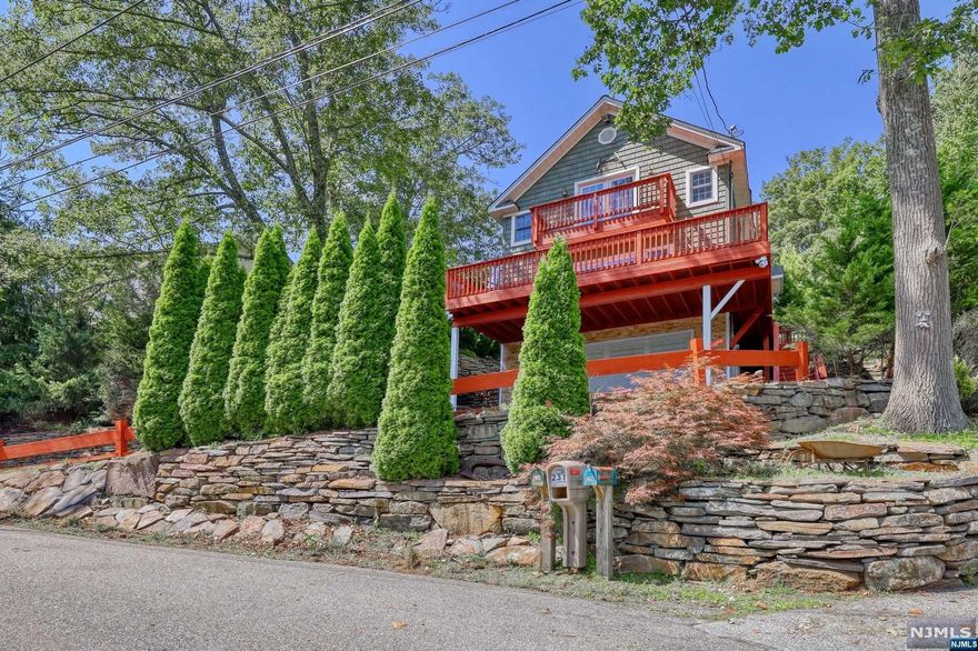 This unique upper Greenwood lakeside home boasts 2 bedrooms, a den, and 1.5 bathrooms. House build in 2010. Enjoy stunning lake views from the large deck &and private master bedroom balcony. Enjoy the back yard paver patio The custom-built features include new hardwood floors second floor, new driveway asphalt, you will love the rock retainer wall & new front entrance stone and modern amenities like a new microwave and new Hub refrigerator. Additionally, residents can take advantage of the nearby beach for a complete lakeside experience.