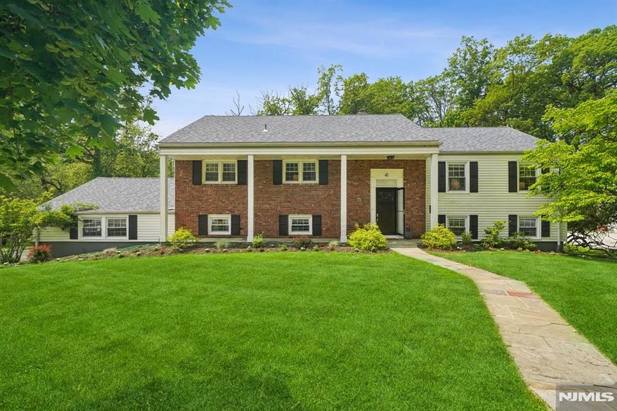 Enjoy this custom home nestled at the end of a quiet cul-de-sac. Your private oasis with a salt-water in-ground pool overlooking nature, woods & Golf course. This home offers the perfect blend of privacy, comfort and outdoor living. Featuring 5 BR, 3 BA. Designed with an open-concept floor plan and wood floors throughout. Central Air, New roof-2024, New Furnace-2024, New Awning -2024. Main level consists of Large LR, DR, open EIK KIT, w/custom cabinets, SS Appliances, Granite countertops. Primary BR, w/Primary ensuite BA-tiled shower, 2 walk-in closets. Two additional BR/Office, Main Hall BA - tub-shower. Lower level consists of the amazing Great RM, with Stone FP, access to deck from glass slider doors, built-in custom bookcases. Additional Bedroom with Full BA, can be used as in-law suite, additional BR/Office, laundry Rm, storage Rm, access to 2-car garage. The deck is equipped with built-in seating and full outdoor kitchen, Hot tub, Awning ideal for entertaining and hosting guests or enjoying summer evenings. This space is a true outdoor retreat. Bonus Rm off garage can be used as "Art, Music, Gym" Multi-purpose Rm. Located near shops, parks, schools, restaurants, NYC transportation. This home offers the rare combination of natural beauty, comfort convenience indoor & outdoor.