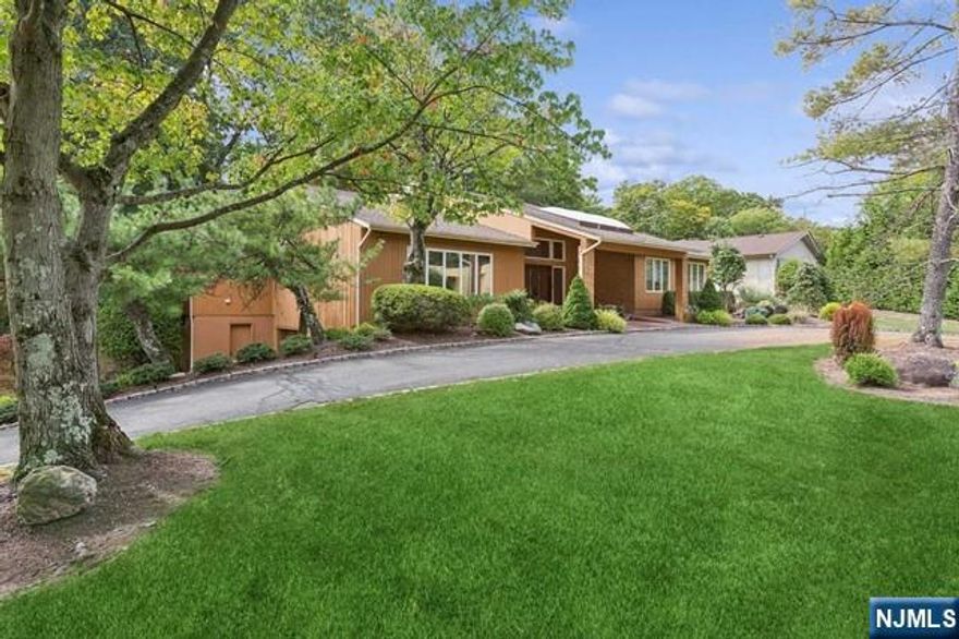 Welcome to your dream home in Forest Park, located in the heart of Livingston, a prime location that offers everything you've been waiting for. This stunning residence features soaring ceilings and an open floor plan. From the moment you step into the large entry foyer, you'll appreciate the superb design and flow. The well-defined spaces include a spacious Great Room, Sunken Living Room, and oversized Dining Room, making both living and entertaining a breeze. The expansive eat-in kitchen, with sliders leading to a gorgeous deck, is a chef's delight. Enjoy the convenience of a first-floor primary bedroom with three additional bedrooms. A generous lower level boasts a tremendous recreation room and additional rooms perfect for a playroom, office, gym, or media room. These areas can also be combined with the rec room to create a massive entertainment space. This home truly has it all. Don't miss this opportunity to make this house your home!