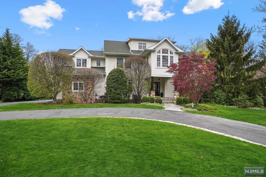 Resting on just over a half an acre, this newly built, Custom Colonial home enjoys a convenient and desirable location, close to everything this thriving community has to offer. Defined by elegant architectural details, spacious sun-filled rooms and high ceilings, this home provides practical function both inside and out. The traditional layout offers a welcoming entry foyer flanked by a formal dining room with butler's pantry and traditional living room. The first floor includes an expansive Family room with fireplace and wet bar, the perfect space for all to gather. As sunlight pours in through large windows, the neutral decor and gleaming hardwood floors welcomes an array of furnishings.You will be thrilled with this well-equipped kitchen, while the easy flowing floor plan is made for entertaining and daily living. Bedrooms are nestled on upper levels, offering restful sleep for everyone. Lower level walk-out recreation room with bedroom and bath is open and bright.