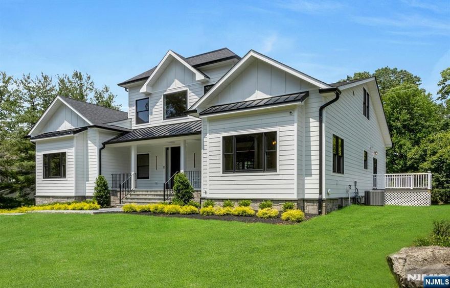 A Hidden Gem of Exquisite Design & Exceptional Amenities, this Luxury New Construction/Existing Foundation is nestled on a Quiet Tree Lined Cul-de-sac in the Heart of Ramsey on a 0.5acre Flat Lot. Modern Elegance, Outstanding Quality & Expert Craftsmanship define this Sophisticated On Trend CH Colonial featuring Open Floor Concept Flooded w/Natural Light. Comprising ~6300sf of Finished Interior Space across 3 Levels, this Home offers 6BR, 7Bath & 3 Car Garage. 2Sty EF opens into Vaulted GreatRm focused on Floor2Ceiling SGD System to Covered/Coffered Lanai w/Outdoor Cooking Center & Gas FPL o/lookn Large Open Backyard. Kitchen w/Center Island & BarStool Seating is appointed w/Quartz Counters, Custom Cabinets, Top of Line SS Appliances, Pantry & Bkfst Area w/SGD to Trex Deck. MBR Ste w/Tray Ceiling & Cove Lighting includes O/S Boutique WIC/DressingRm w/Custom BuiltIns and Spa Inspired MBath w/Free Standing Soaking Tub, Stall Shower w/Rainhead & Designer Tiles. Finished Walkout Bsmnt comes complete with RecRm/Lounge/WetBar, GameRm w/SGD to Stone Patio, Theater, Gym, Office Ste/Bath, BR & Full Bath. Amenities: Central Vac, Irrigation System, Radiant Heat in Baths, Full House B/U Generator Ready, Custom Closets, Security Cameras, Landscaping Package, Lanai, Deck & Patio. Rich in Community Spirit & Natural Beauty, Ramsey offers Top Rated Schools, Parks & Ponds, Quaint Downtown Shopping District, Fine Dining, Theme Park Style Pool, Farmers Market, RG&CC & Convenient NYC Transport.